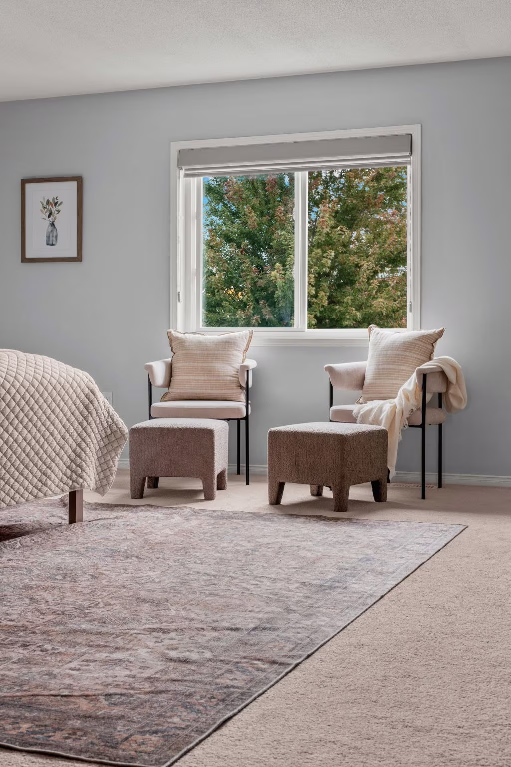 Primary bedroom sitting area at 1683 Finkle Drive, Oshawa, with two accent chairs and ottomans by the window