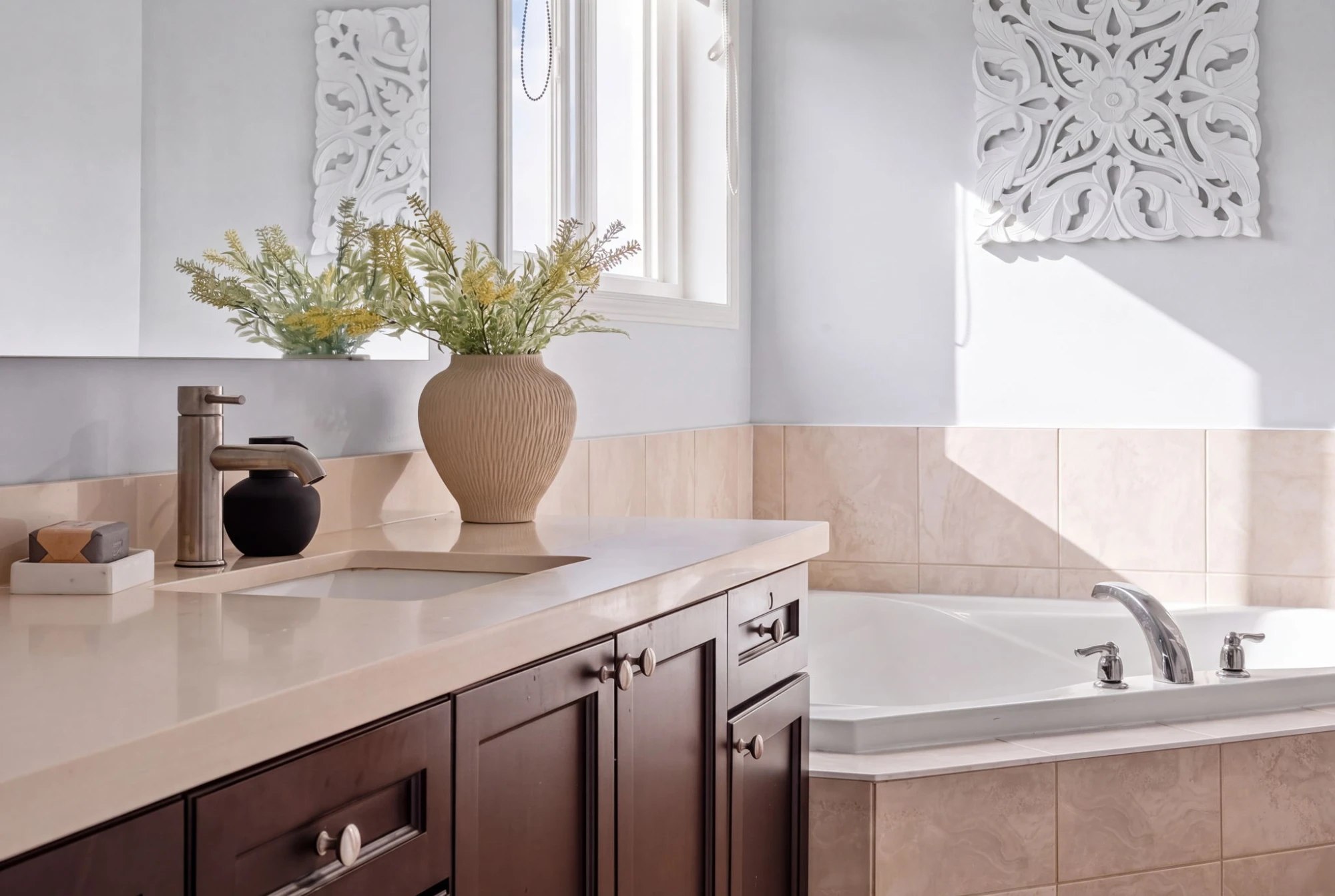 Primary ensuite vanity styling detail at 1683 Finkle Drive, Oshawa, with the corner soaker tub beyond