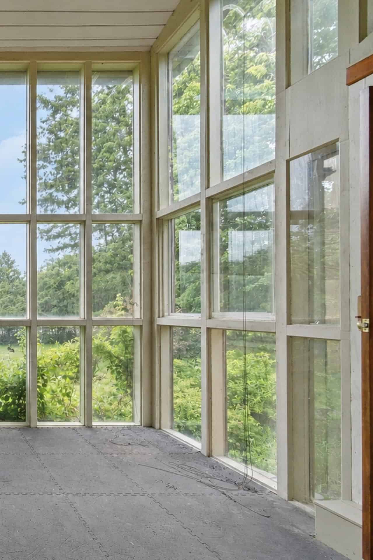 Detail of the glass conservatory windows at 17 Ontoro Blvd, South East Ajax, overlooking mature trees