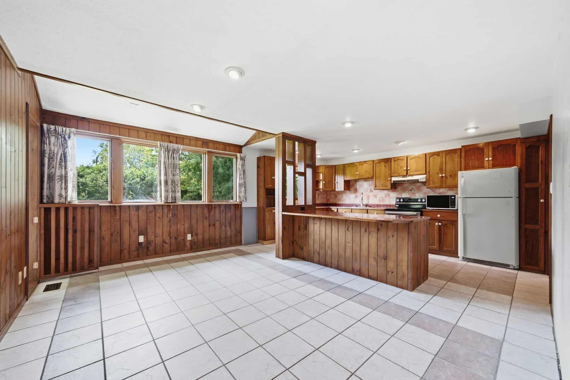 European country kitchen at 17 Ontoro Blvd, South East Ajax, with wood cabinetry and multiple windows