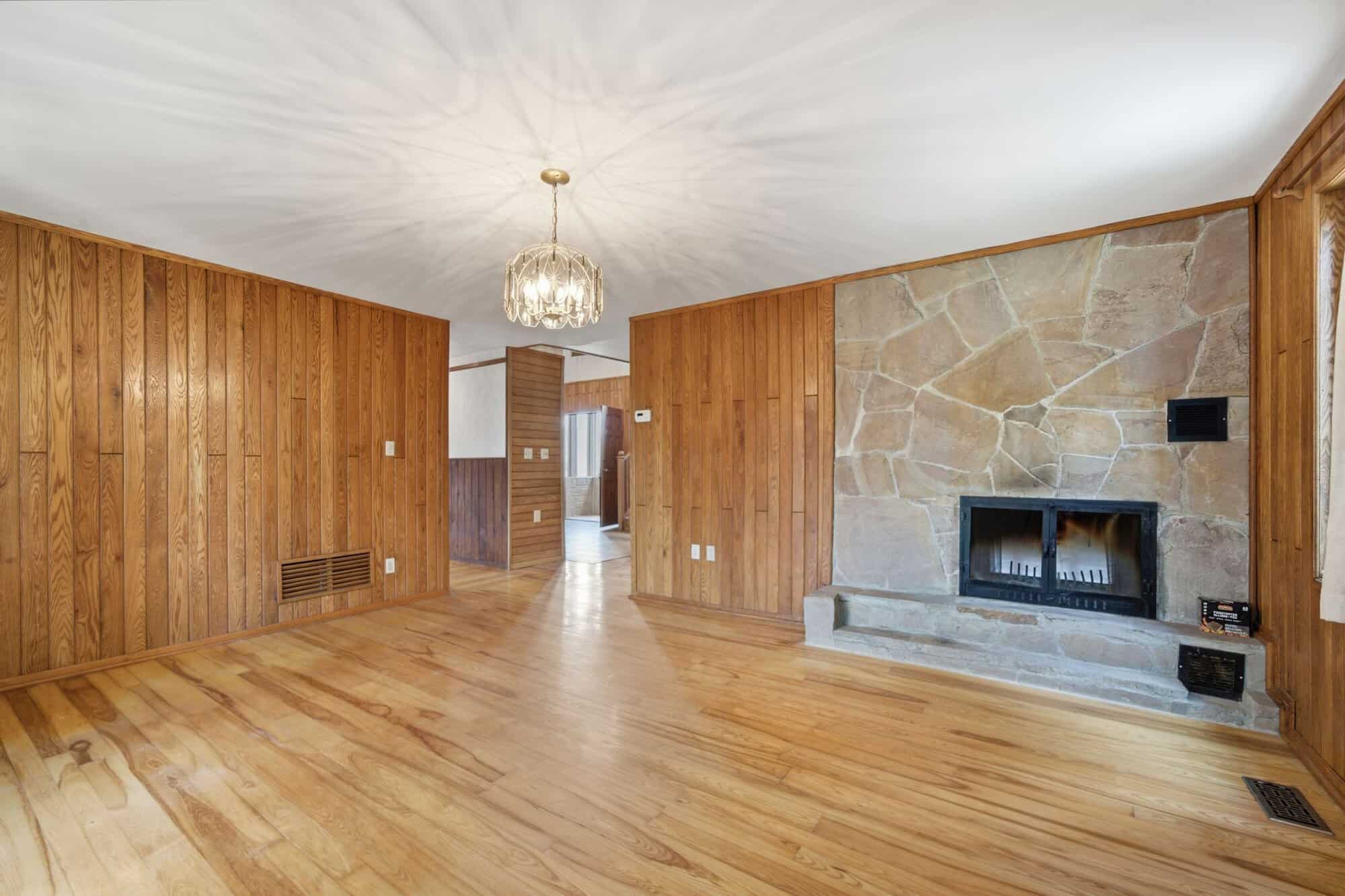 Parlour at 17 Ontoro Blvd, South East Ajax, with hardwood floors and natural wood accents