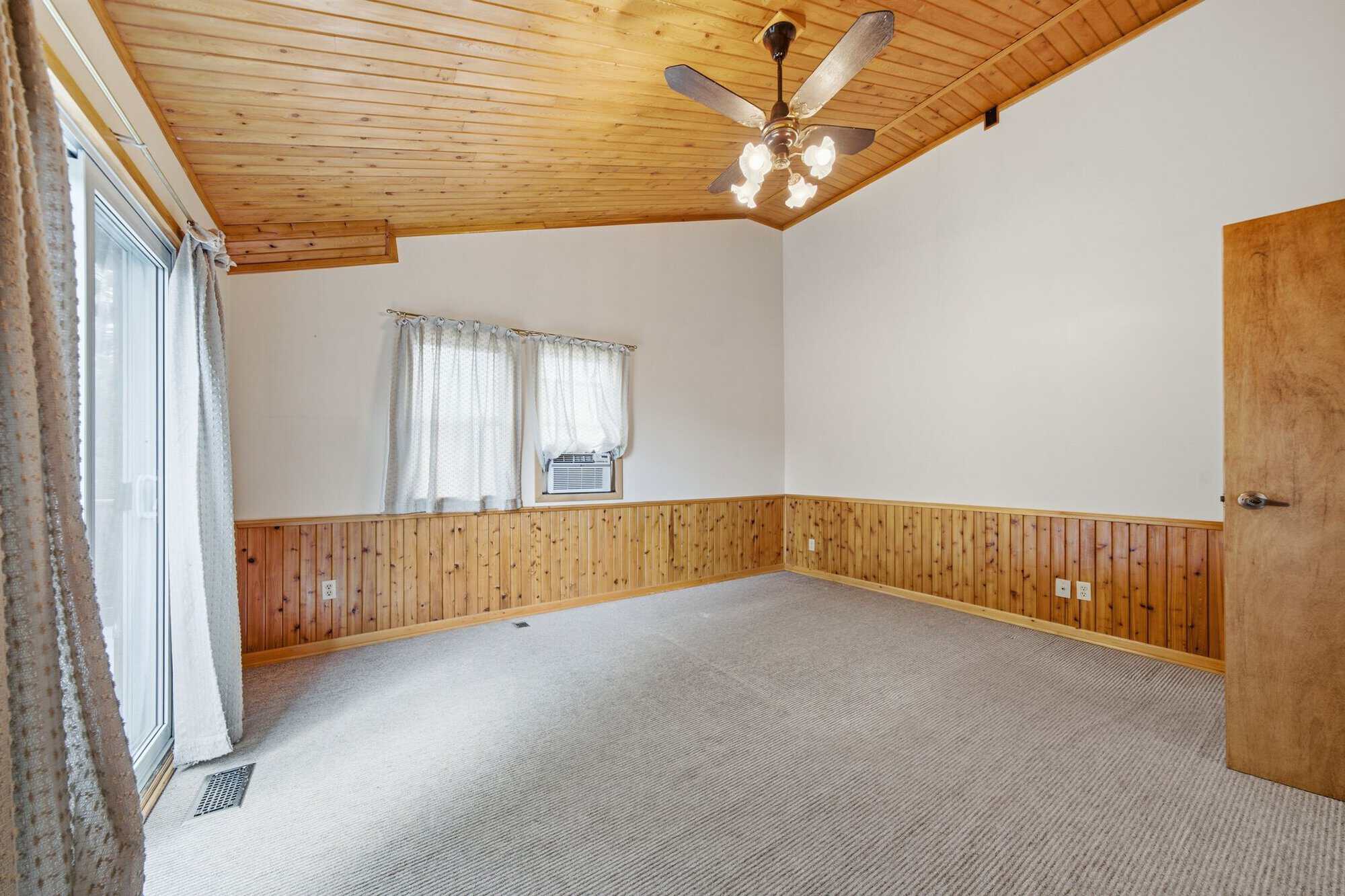 Primary suite at 17 Ontoro Blvd, South East Ajax, with a soaring cedar-clad vaulted ceiling