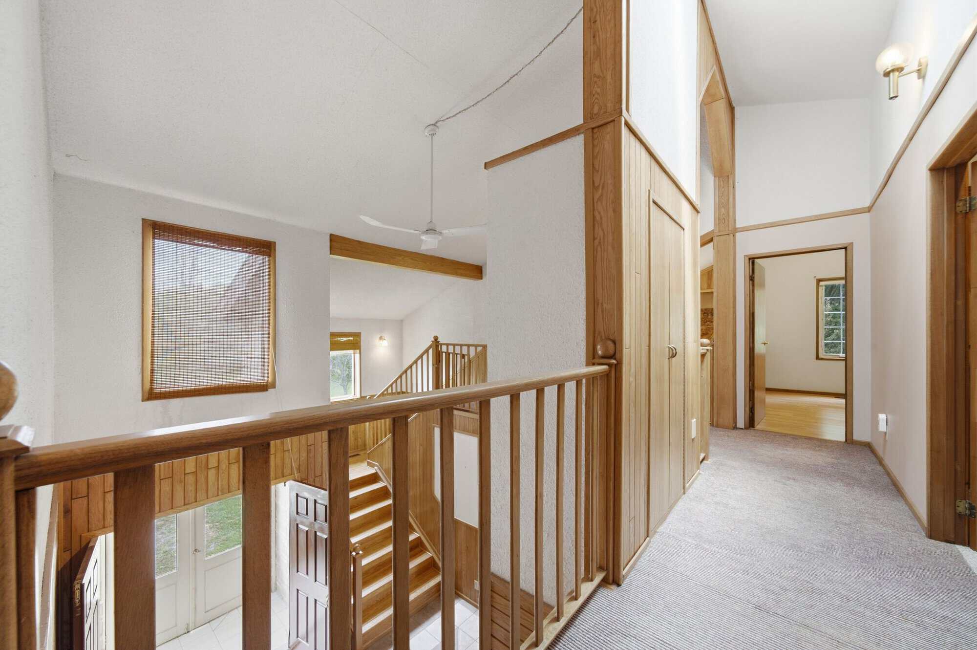 Upper landing bridge at 17 Ontoro Blvd, South East Ajax, overlooking the two-storey conservatory