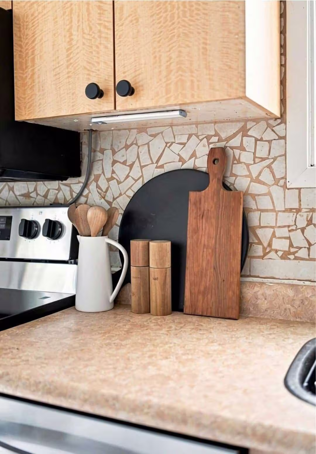 Kitchen counter detail at 22 Kipling Cres, South Ajax, with cutting boards, wooden utensils and the mosaic backsplash, listed by Laura McBride, Ajax REALTOR®