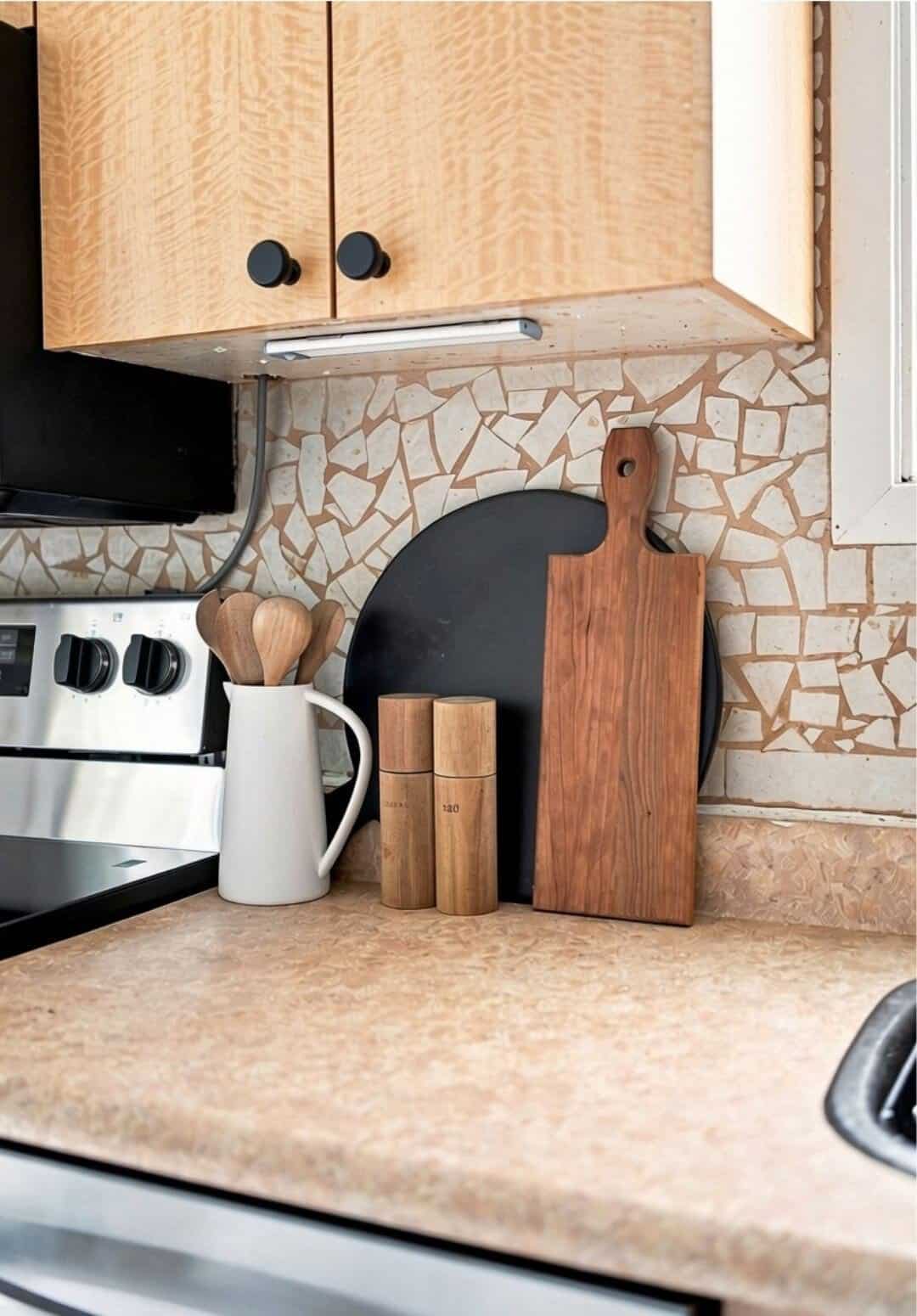Kitchen counter detail at 22 Kipling Cres, South Ajax, with cutting boards, wooden utensils and the mosaic backsplash, listed by Laura McBride, Ajax REALTOR®