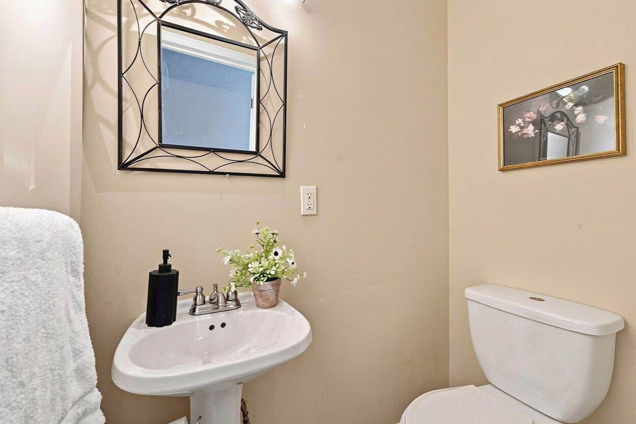 Main-floor 2-piece powder room at 22 Kipling Cres, South Ajax, listed by Laura McBride, Ajax REALTOR®