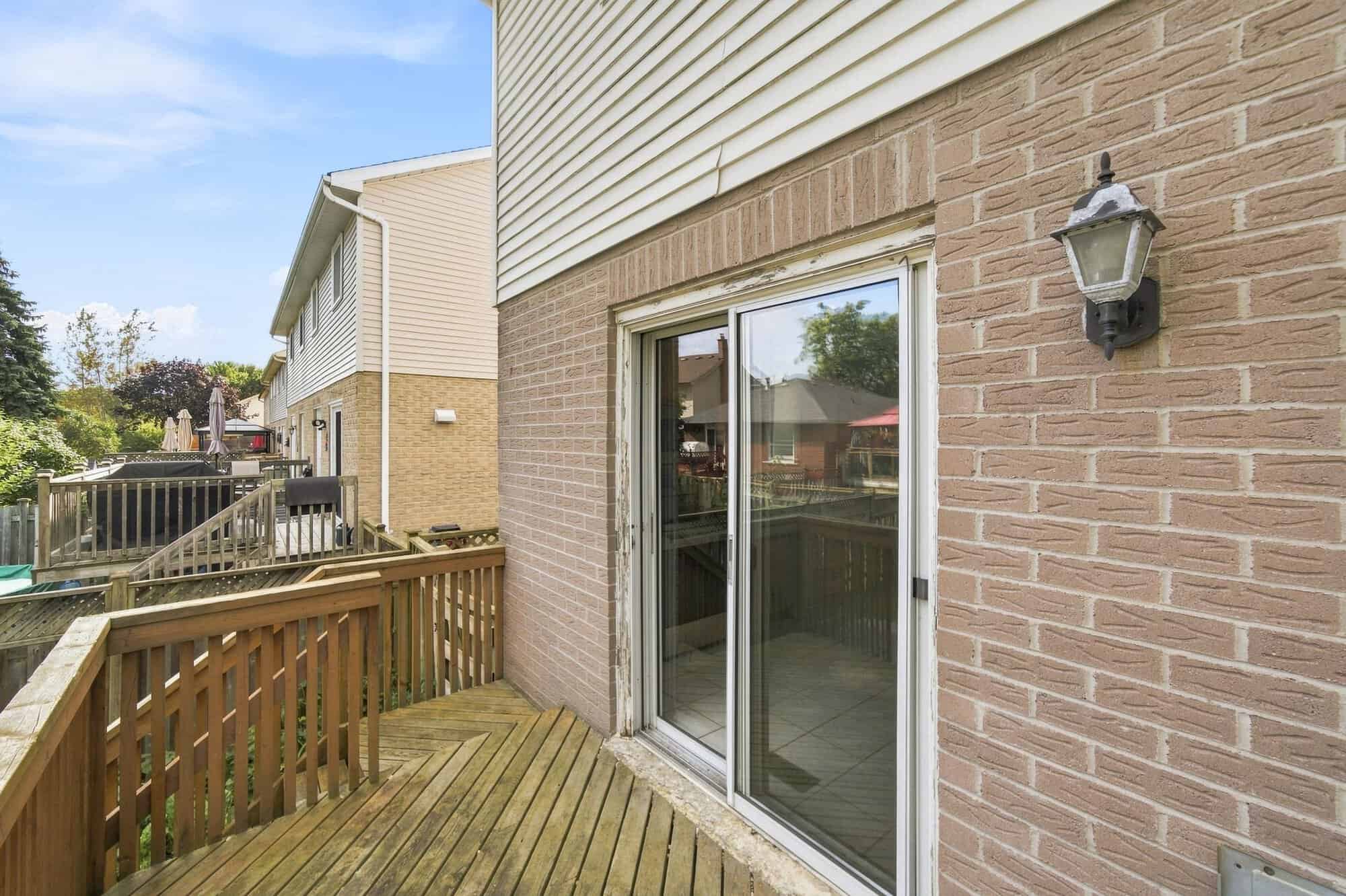 Rear deck off the kitchen overlooking the fenced backyard at 22 Kipling Cres, South Ajax, listed by Laura McBride, Ajax REALTOR®