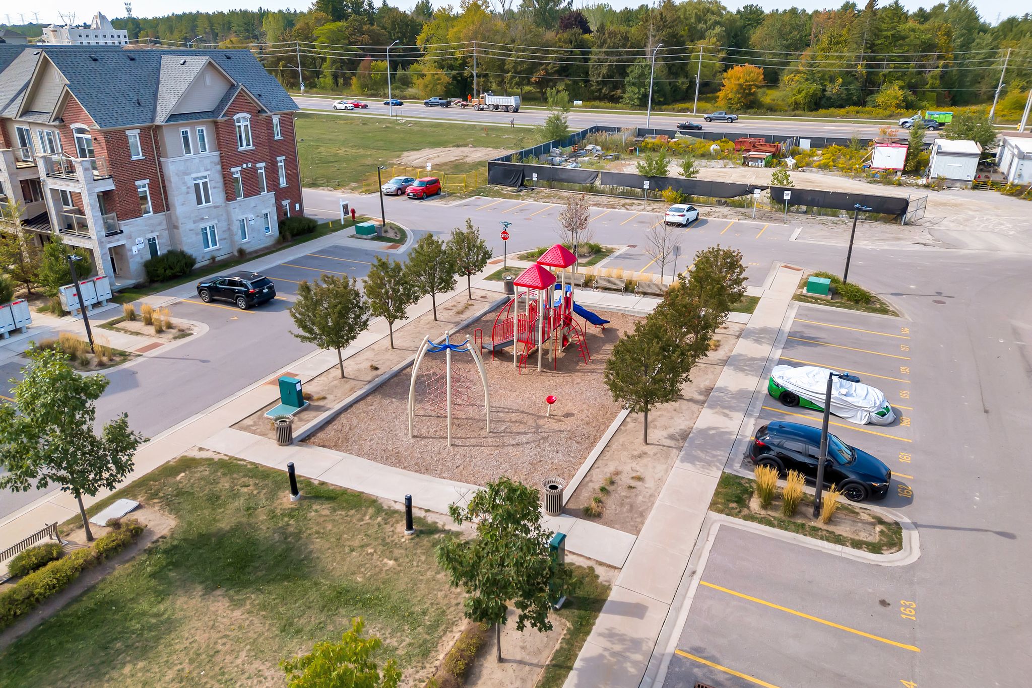 Aerial view of the parking area and playground at 2598 William Jackson Dr, Pickering