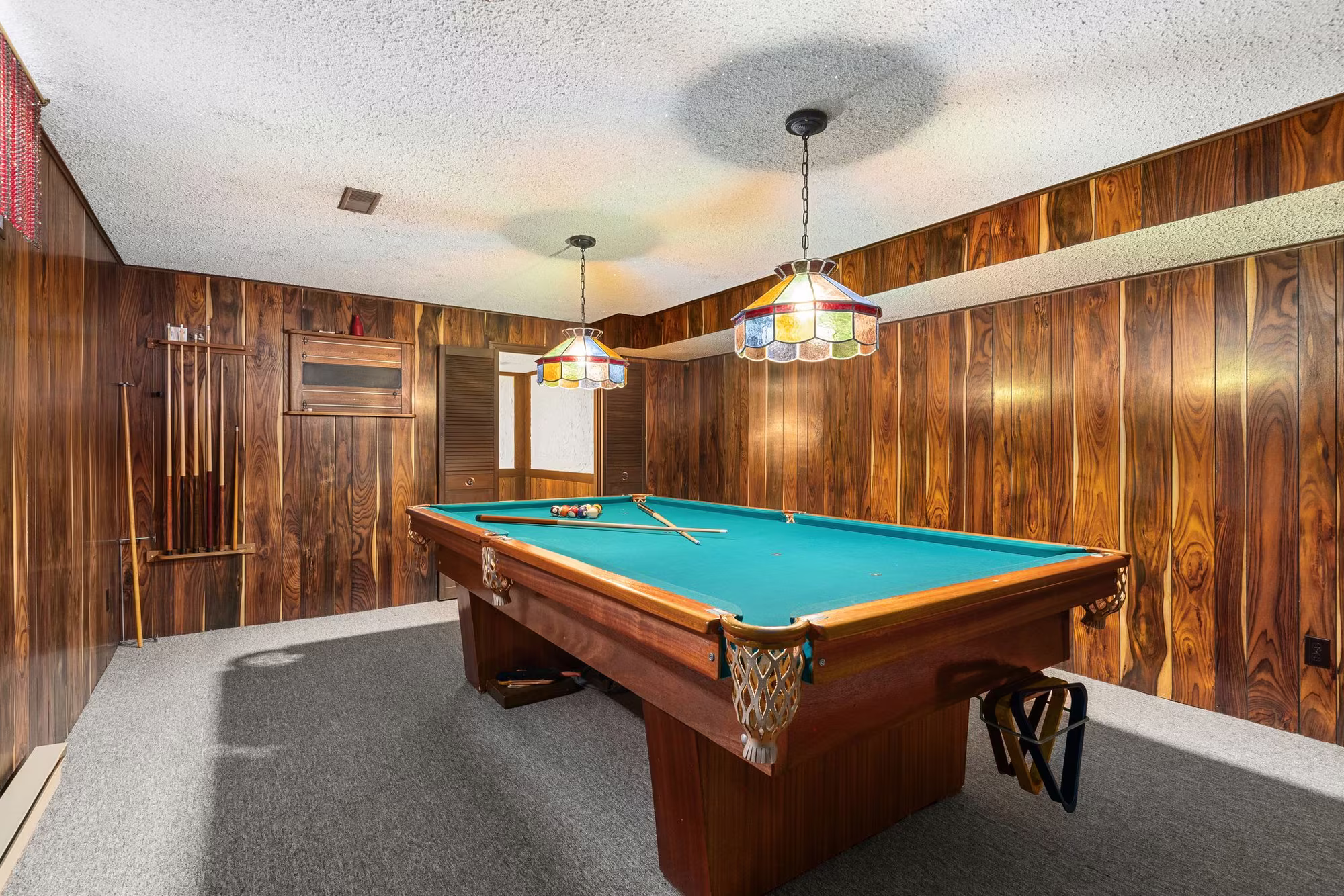 Billiard room, usable as a fifth bedroom, in the finished basement at 38A Deep Dene Dr, Highland Creek Village