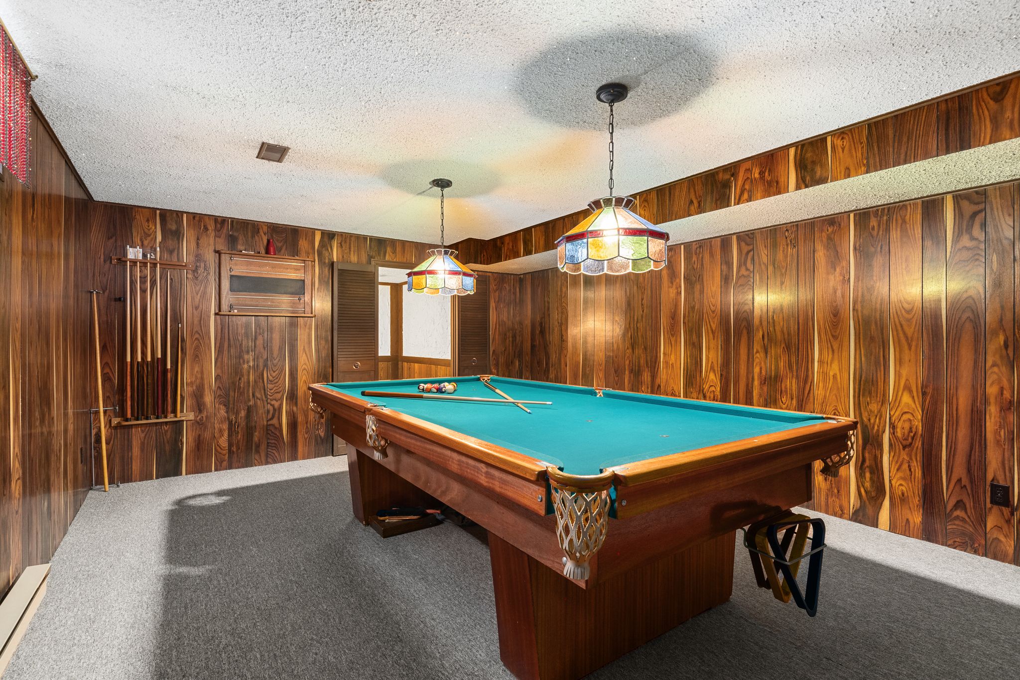 Billiard room, usable as a fifth bedroom, in the finished basement at 38A Deep Dene Dr, Highland Creek Village