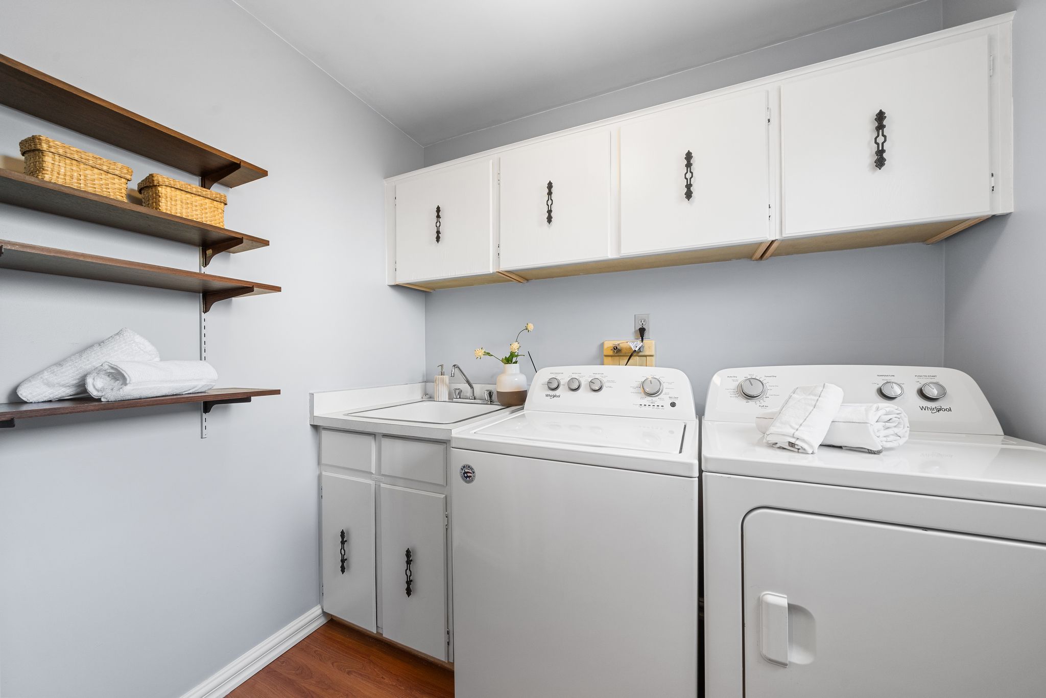 Main floor laundry room at 38A Deep Dene Dr, Highland Creek Village, with side door access