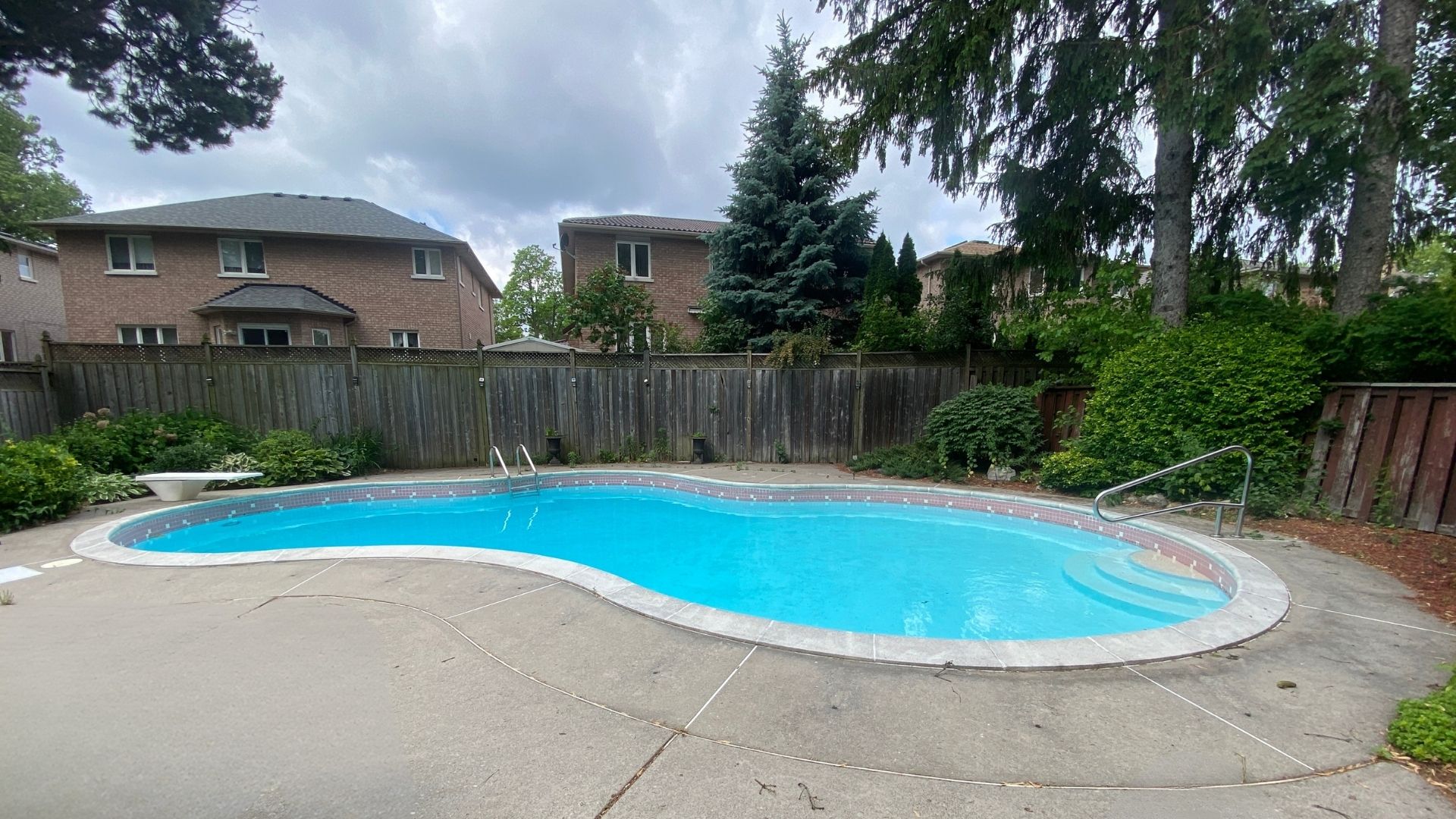 Heated inground pool in the fenced backyard at 38A Deep Dene Dr, Highland Creek Village