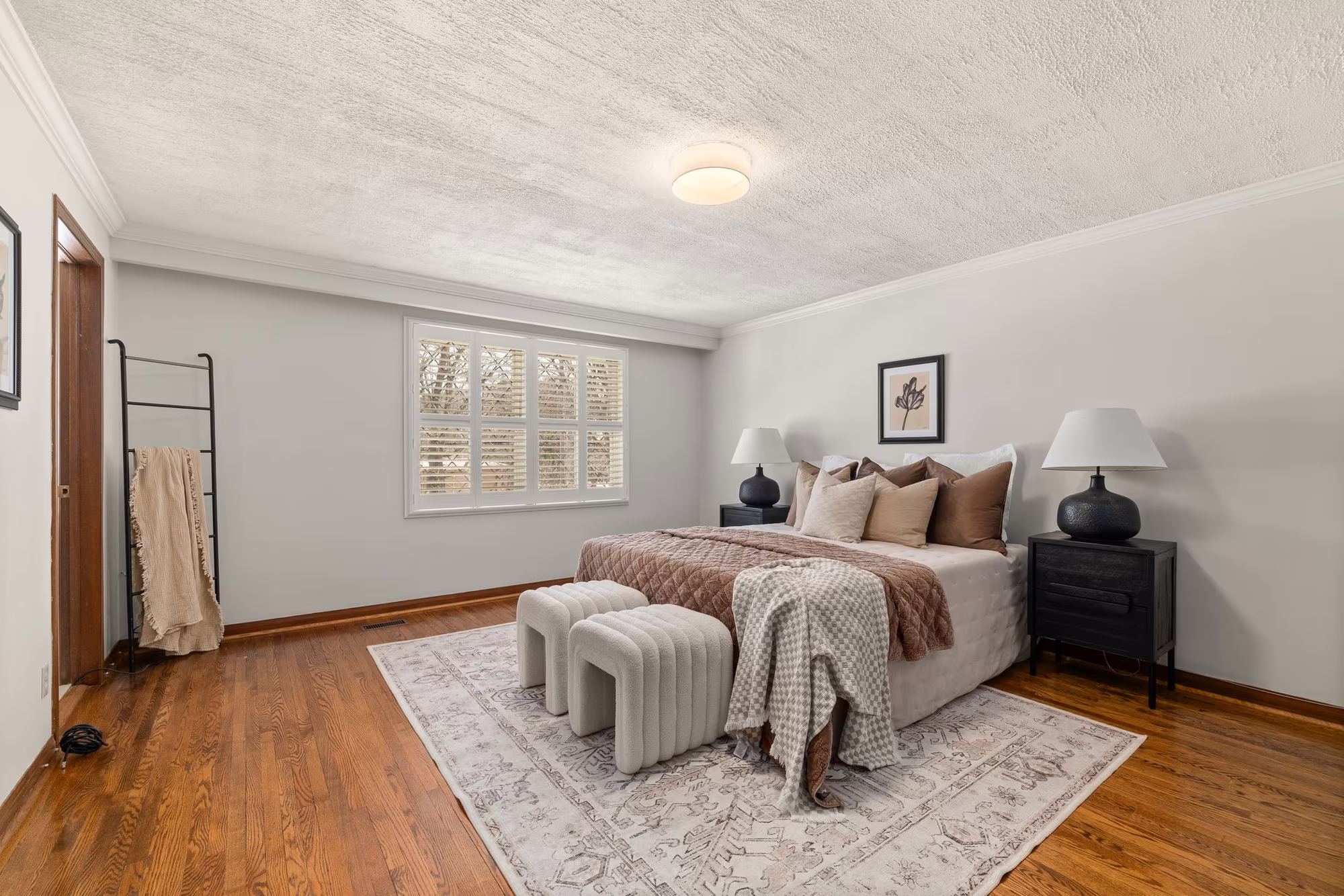 Primary bedroom at 38A Deep Dene Dr, Highland Creek Village, with hardwood floors and neutral decor