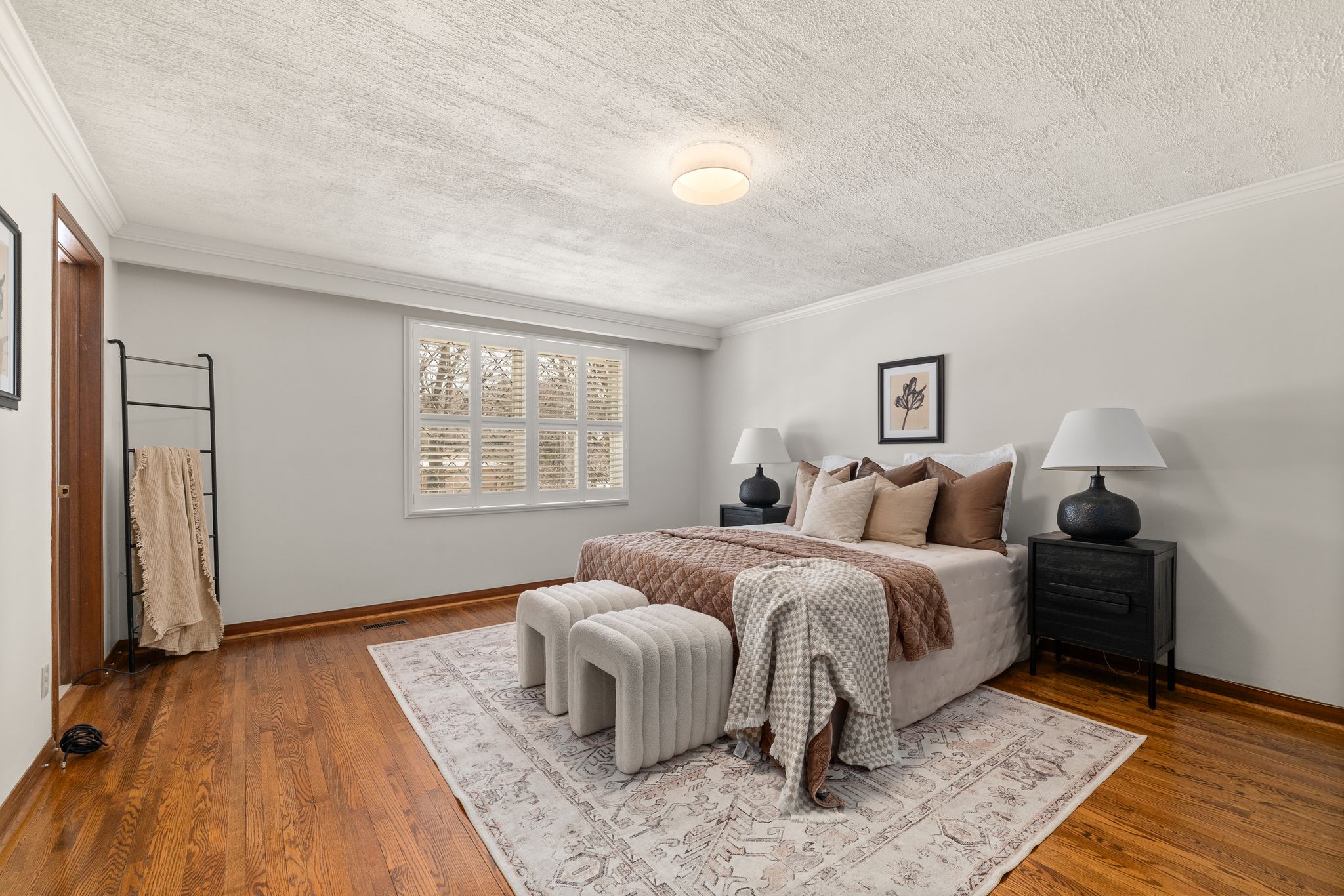 Primary bedroom at 38A Deep Dene Dr, Highland Creek Village, with hardwood floors and neutral decor