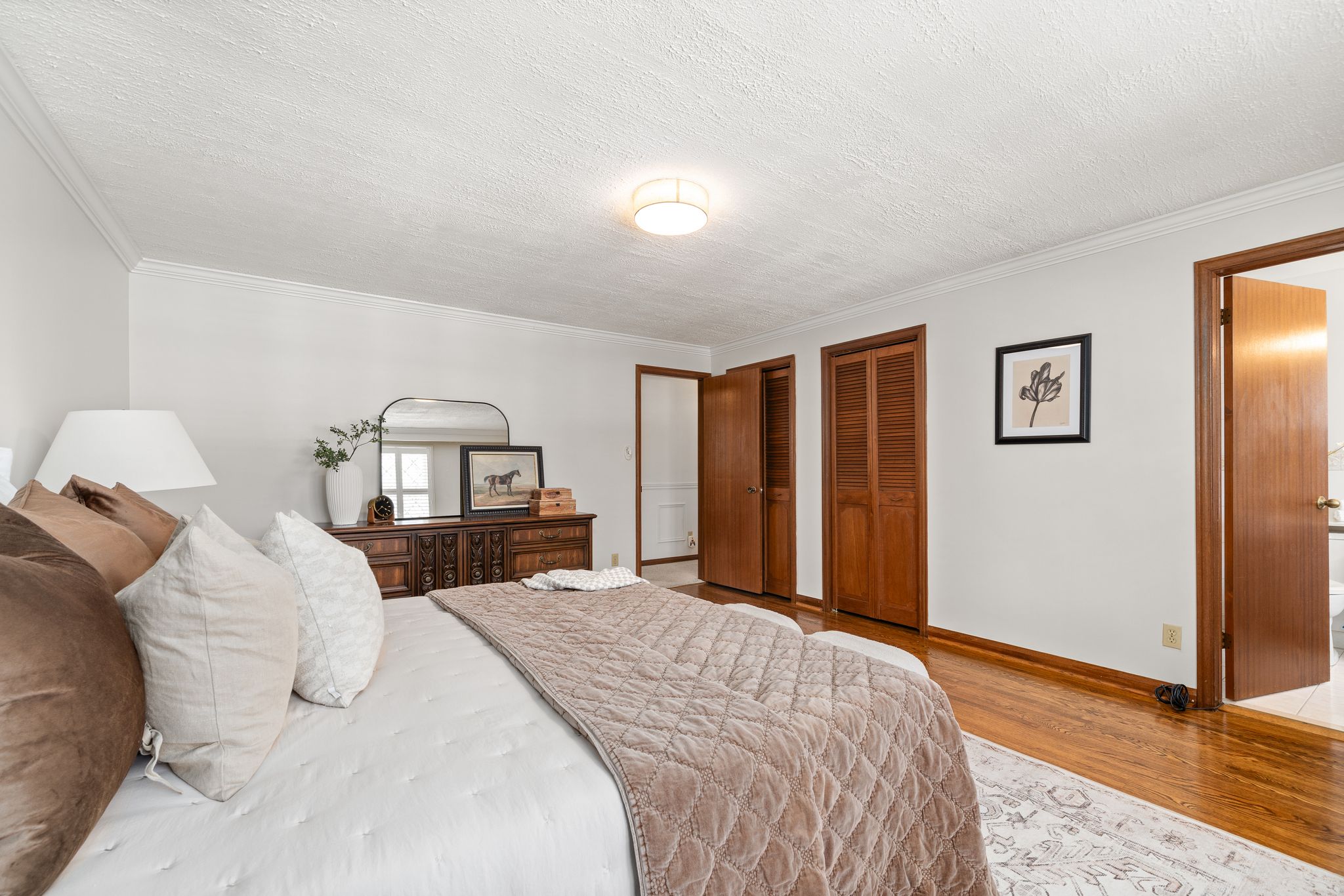 Primary bedroom at 38A Deep Dene Dr, Highland Creek Village, with his and hers closets