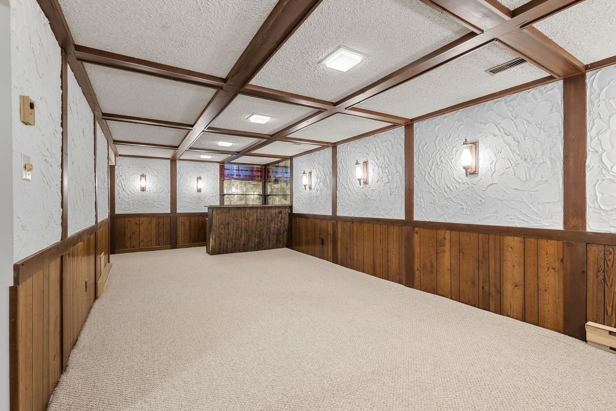 Recreation room in the finished basement at 38A Deep Dene Dr, Highland Creek Village, with wood paneling