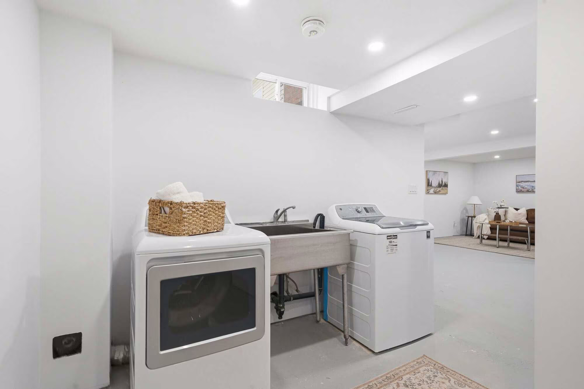 Concept rendering of basement laundry at 39 Anstead Crescent, South Ajax, virtually staged