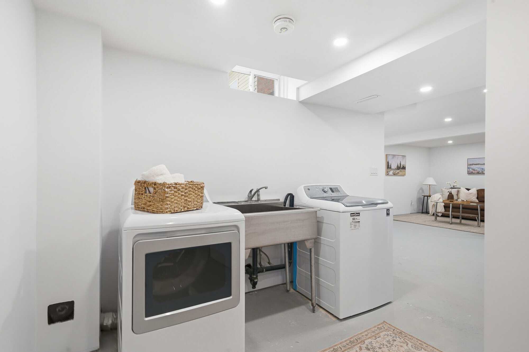 Concept rendering of basement laundry at 39 Anstead Crescent, South Ajax, virtually staged