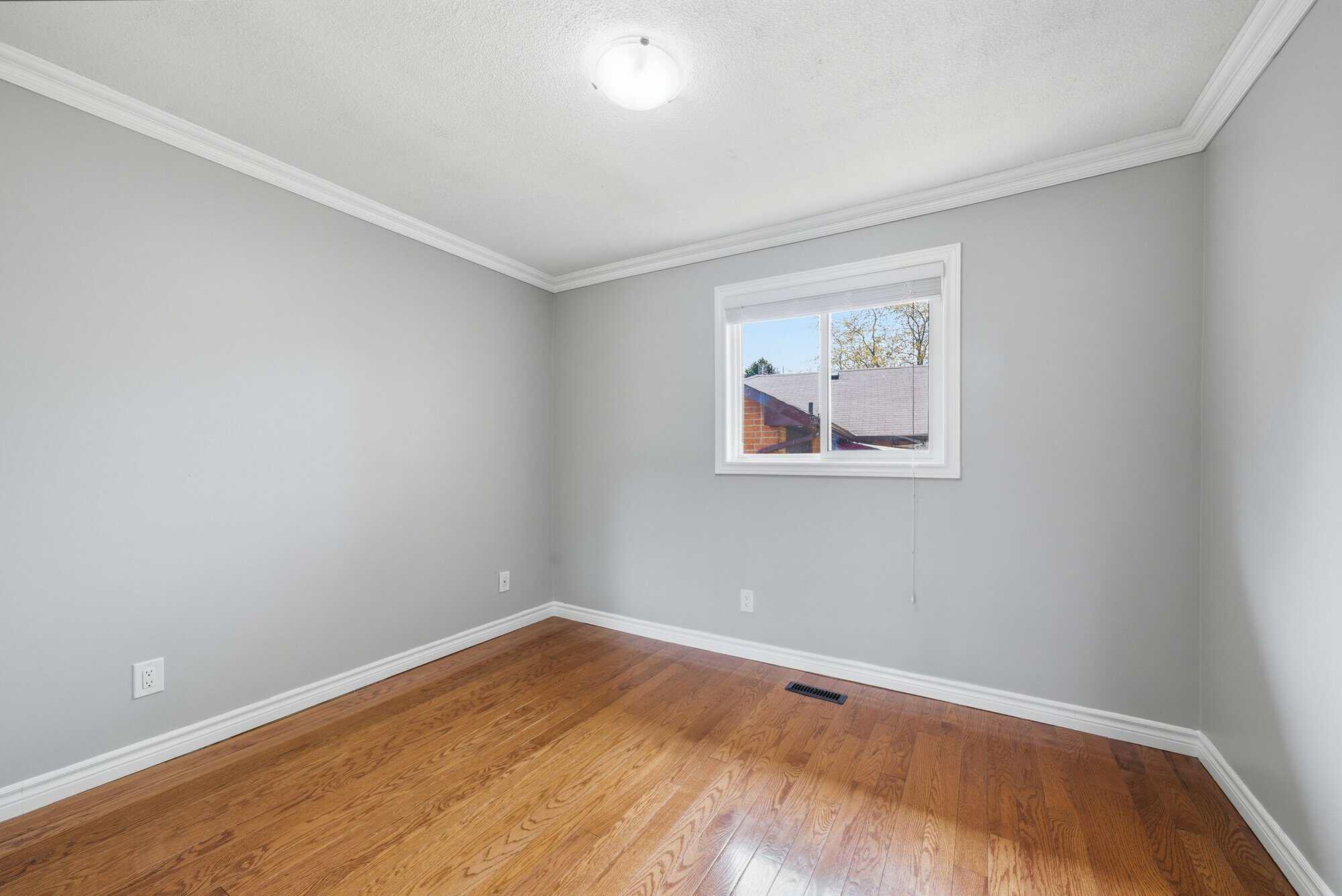 Second bedroom at 39 Anstead Crescent, South Ajax, with hardwood floors and neutral finishes