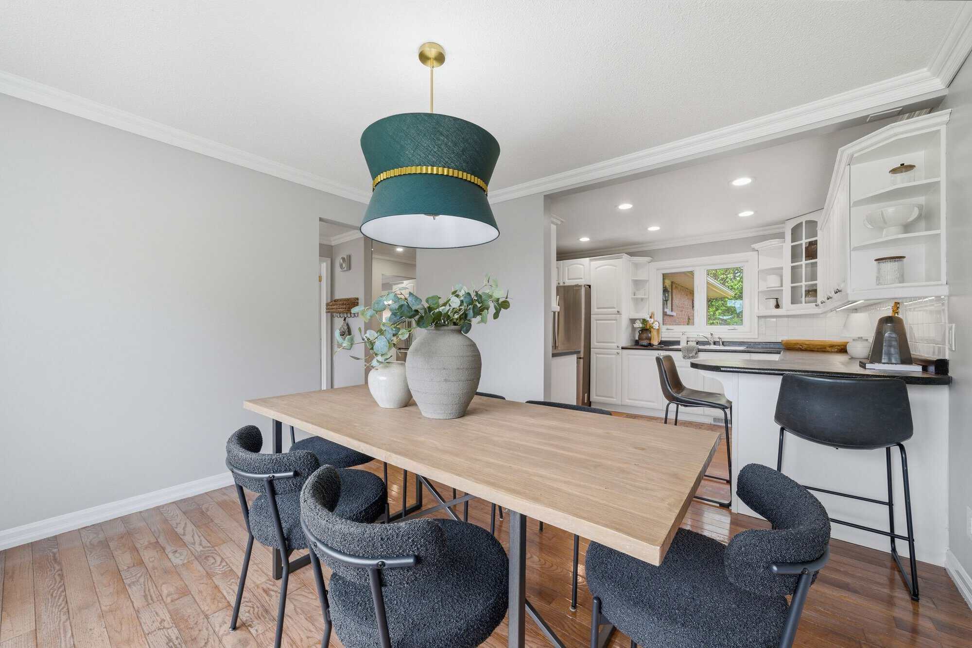 Gather-style dining area at 39 Anstead Crescent, South Ajax, with a wood table and pendant light