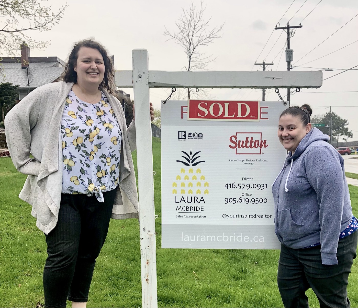 Pickering buyers with the keys to their new home and Laura McBride, REALTOR&reg;