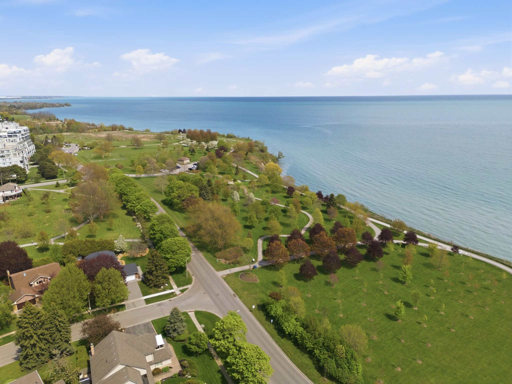 Aerial view of the Ajax Waterfront Trail curving along Lake Ontario in South Ajax, near Laura McBride's Discovery Bay and Duffin's Bay listings