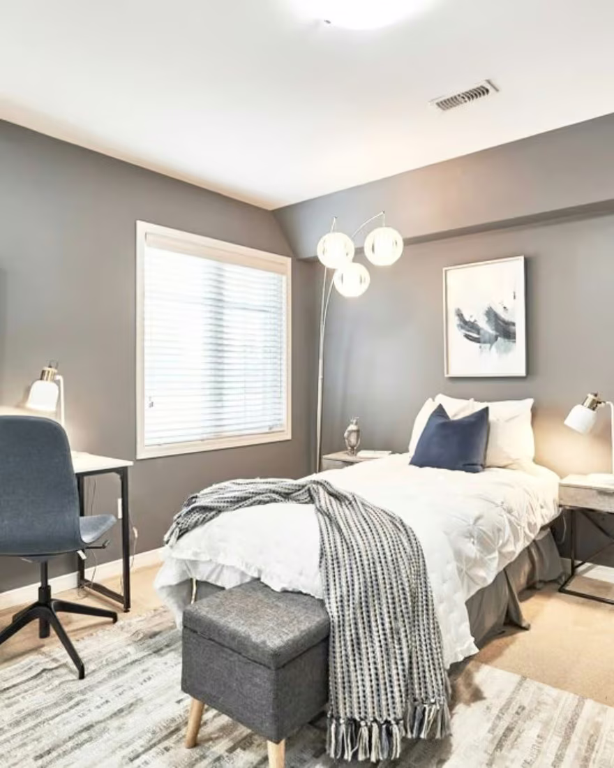 The same room after staging, transformed into a calm guest bedroom